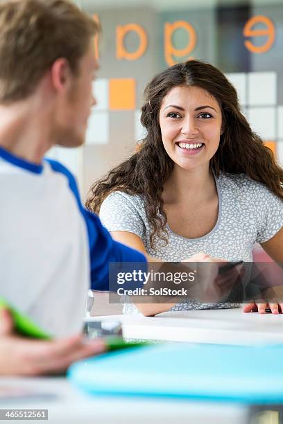 students exchanging technology - time of day stock pictures, royalty-free photos & images