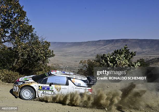 Norwegian driver Mads Ostberg steers his Citroen DS3 WRC, during the second day of the 2015 FIA World Rally Championship in Leon, Guanajuato State,...