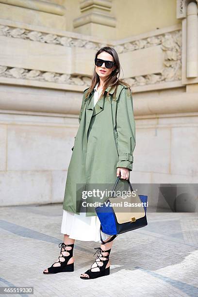 Zina Charkoplia poses wearing a Zara jacket, Reiss skirt, Chloe shoes and Celine bag on Day 5 of Paris Fashion Week Womenswear FW15 on March 7, 2015...