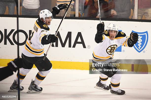Brad Marchand and Loui Eriksson of the Boston Bruins celebrate a goal against the Philadelphia Flyers at the TD Garden on March 7, 2015 in Boston,...