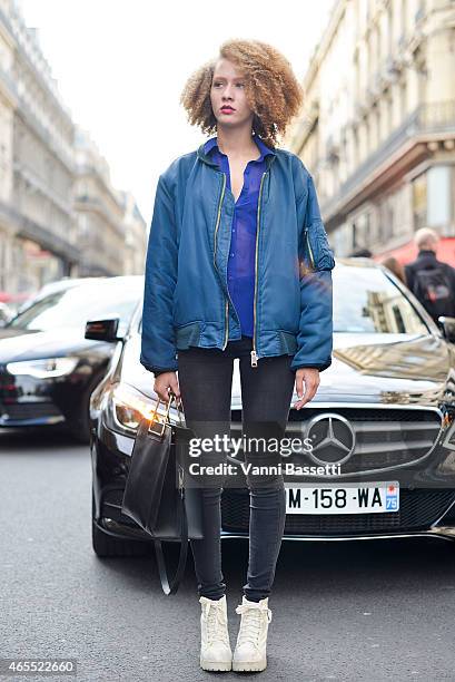 Carla Joliviere poses wearing a vintage outfit on Day 5 of Paris Fashion Week Womenswear FW15 on March 7, 2015 in Paris, France.