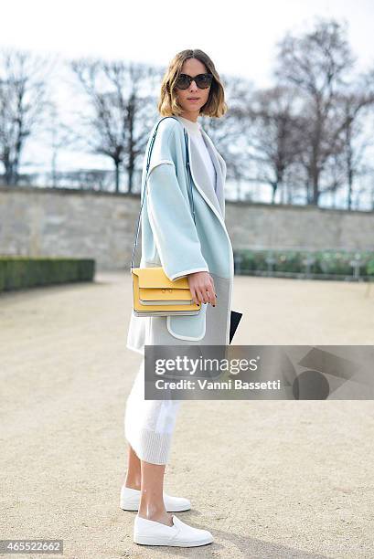 Candela Novembre poses wearing an Iceberg coat and Marni bag on Day 5 of Paris Fashion Week Womenswear FW15 on March 7, 2015 in Paris, France.