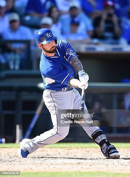 Ryan Roberts of the Kansas City Royals swings at a pitch against the Texas Rangers on March 4, 2015 at Surprise Stadium in Surprise, Arizona.