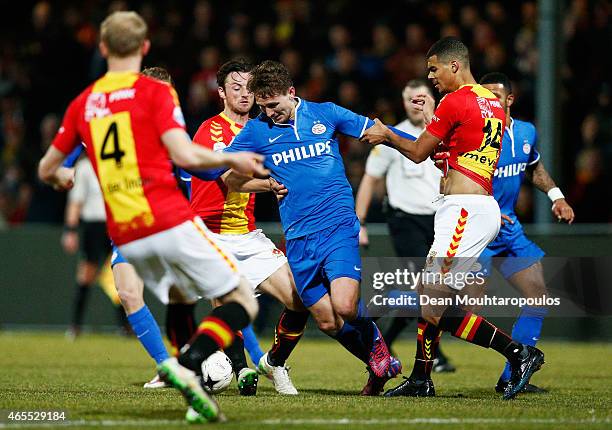Luuk de Jong of PSV in action against Mawouna Kodjo Amevor and Jop van der Linden of Go Ahead Eagles during the Dutch Eredivisie match between Go...