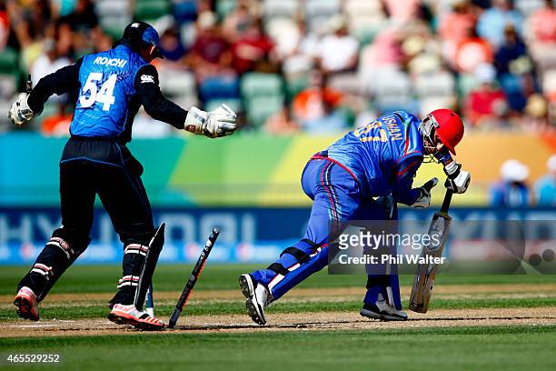 Usman Ghani of Afghanistan is bowled by Daniel Vettori of New Zealand during the 2015 ICC Cricket World Cup match between New Zealand and Afghanistan...
