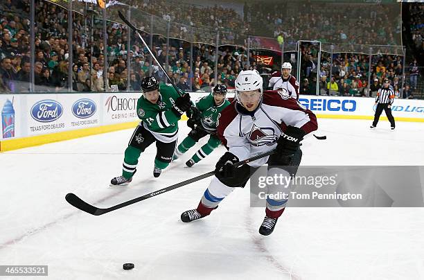 Erik Johnson of the Colorado Avalanche controls the puck against Ray Whitney of the Dallas Stars in the first period at American Airlines Center on...