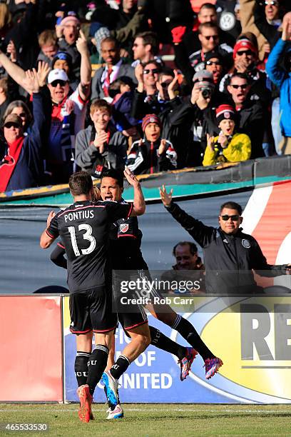 Jairo Arrieta of D.C. United celebrates with Chris Pontius after scoring a second half goal against the Montreal Impact during their 1-0 win at RFK...