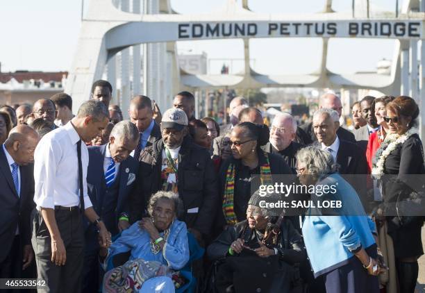 President Barack Obama speaks to Amelia Boynton Robinson , one of the original marchers, alongside US Representative John Lewis , Democrat of Georgia...