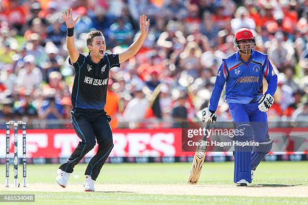 Trent Boult of New Zealand appeals successfully for the wicket of Javed Ahmadi of Afghanistan while Usman Ghani looks on during the 2015 ICC Cricket...