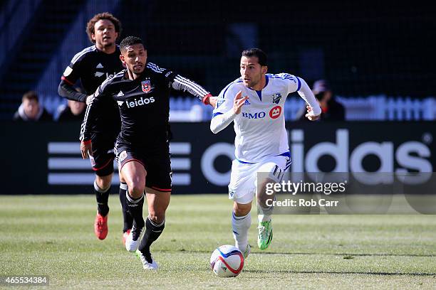 Sean Franklin of D.C. United and Dilly Duka of Montreal Impact go after the ball during the first half at RFK Stadium on March 7, 2015 in Washington,...