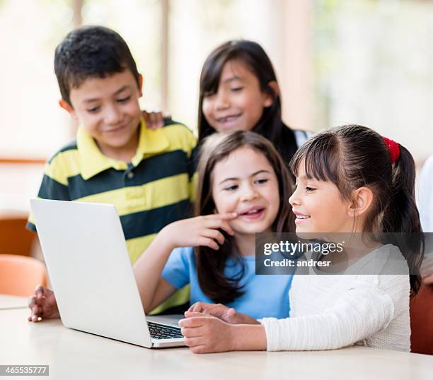 3 Kids Using Computer Kids Sharing Supplies Photos and Premium High Res Pictures - Getty Images