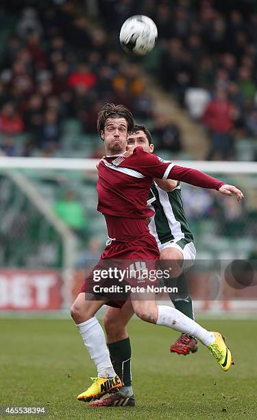 James Gray of Northampton Town attempts to control the ball under pressure from Carl McHugh of Plymouth Argylevduring the Sky Bet League Two match...