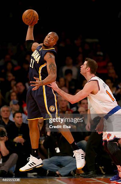 David West of the Indiana Pacers grabs the pass as Jason Smith of the New York Knicks defends at Madison Square Garden on March 7, 2015 in New York...