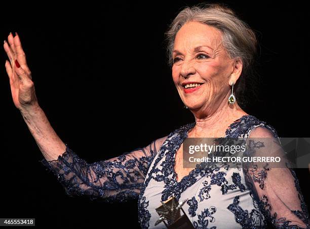 Mexican actress Isela Vega waves during the 30th Guadalajara International Film Festival in Guadalajara on March 7, 2015. AFP PHOTO/ Hector Guerrero