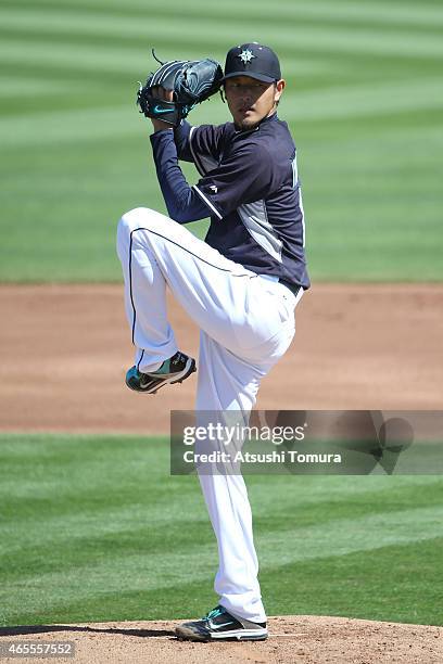 Hisashi Iwakuma of the Seattle Mariners pitches during the spring training game between on the Seattle Mariners and Arizona Diamond Backs at the...