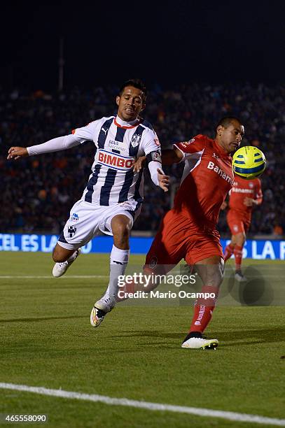Severo Meza of Monterrey fights for the ball with Paulo Da Silva of Toluca during a match between Monterrey and Toluca as part of 9th round Clausura...