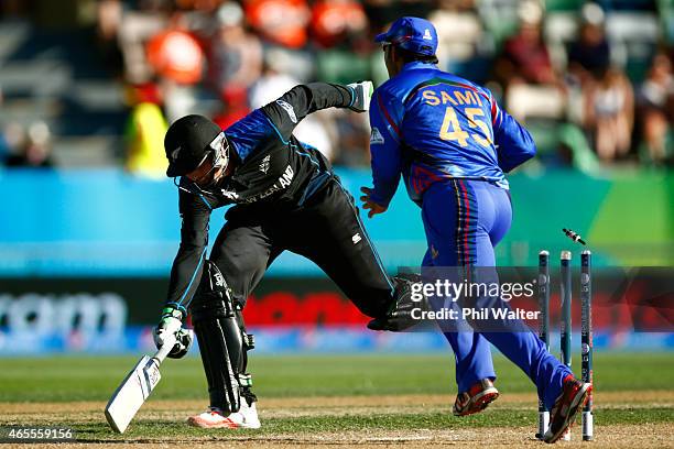 Martin Guptill of New Zealand is run out during the 2015 ICC Cricket World Cup match between New Zealand and Afghanistan at McLean Park on March 8,...