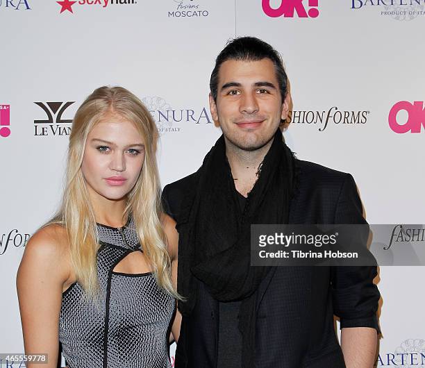 Rebecca Szulc and Nick Simmons attend OK! Magazine's Pre-Oscar event at The Argyle on February 19, 2015 in Hollywood, California.