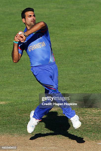 Dawlat Zadran of Afghanistan bowls during the 2015 ICC Cricket World Cup match between New Zealand and Afghanistan at McLean Park on March 8, 2015 in...