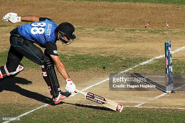 Grant Elliott of New Zealand is run out during the 2015 ICC Cricket World Cup match between New Zealand and Afghanistan at McLean Park on March 8,...