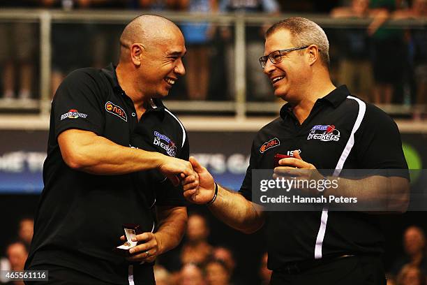 Assistant coach Paul Henare congratulates head coach Dean Vickerman of the Breakers after winning game two of the NBL Grand Final series between the...