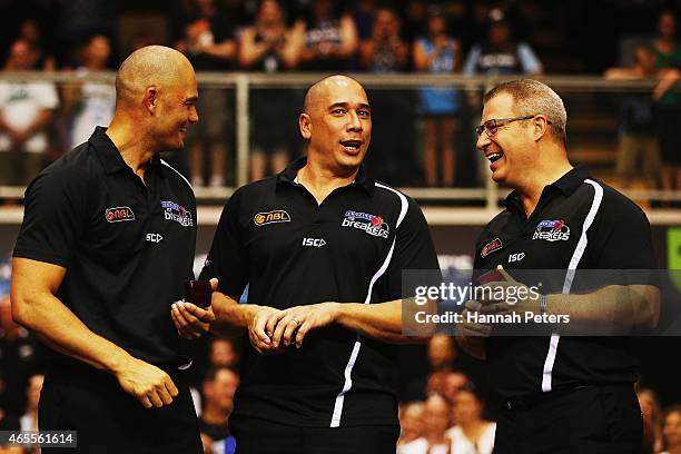 Assistant coaches Judd Flavell and Paul Henare congratulate head coach Dean Vickerman of the Breakers after winning game two of the NBL Grand Final...