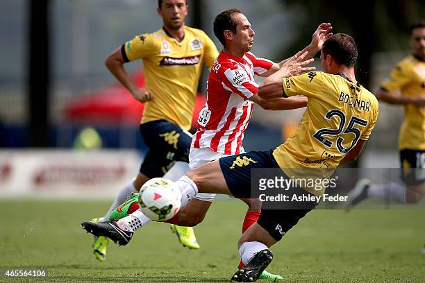 Massimo Murdocca of Melbourne City collides with Eddy Bosnar of the Mariners during the round 20 A-League match between the Central Coast Mariners...