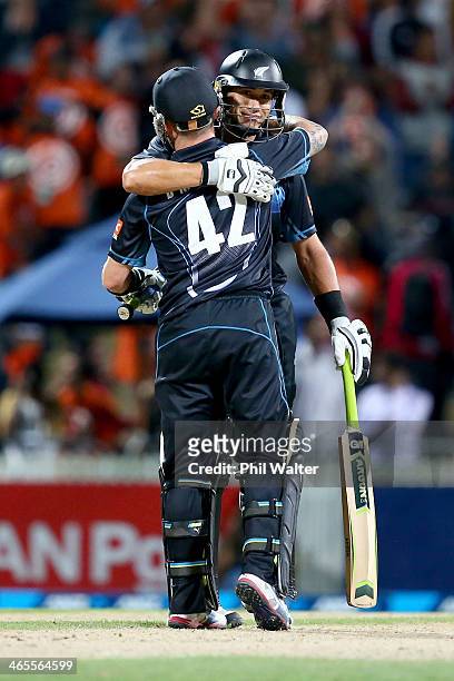 Ross Taylor of New Zealand and Brendon McCullum celebrate following game four of the men's one day international series between New Zealand and India...