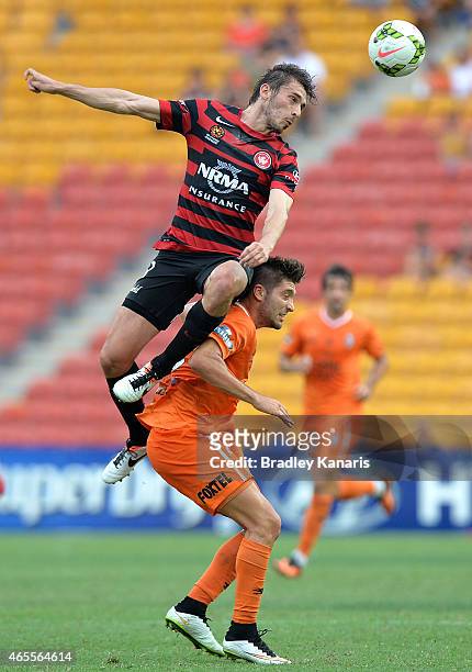 Brandon Borrello of the Roar and Mateo Poljak of the Western Sydney Wanderers challenge for the ball during the round 20 A-League match between the...