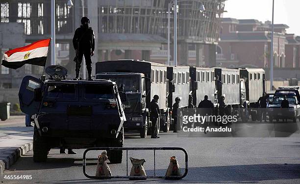 Egyptian security forces stand guard around the Cairo's Police Academy during Egyptian president Mohamed Morsi and other defendants arrived at...