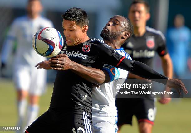 United's Jairo Arrieta, left, and Montreal's Nigel Reo-Coker vie for the ball during the DC United's defeat of the Montreal Impact 1 - 0 at RFK...