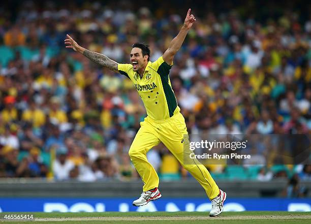 Mitchell Johnson of Australia celebrates after taking the wicket of Lahiru Thirimanne of Sri Lanka during the 2015 ICC Cricket World Cup match...