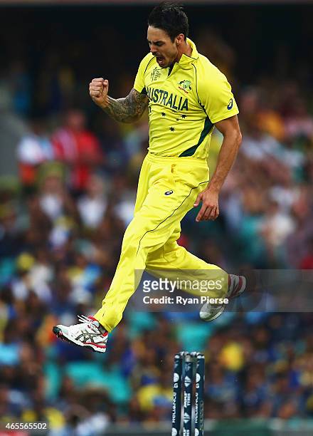 Mitchell Johnson of Australia celebrates after taking the wicket of Lahiru Thirimanne of Sri Lanka during the 2015 ICC Cricket World Cup match...