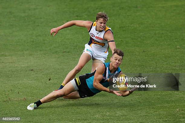 Robbie Gray of the Power attempts a mark in front of Jackson Nelson of the Eagles during the NAB Challenge match between the Port Adelaide Power and...