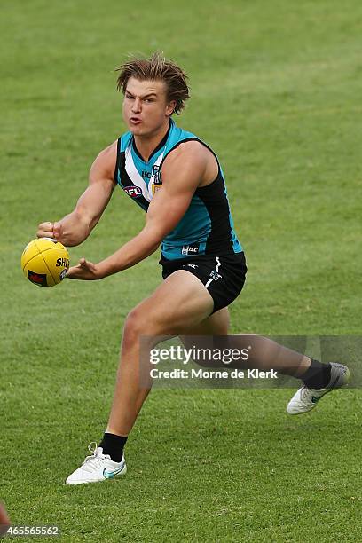 Ollie Wines of the Power passes the ball during the NAB Challenge match between the Port Adelaide Power and the West Coast Eagles at Norwood Oval on...