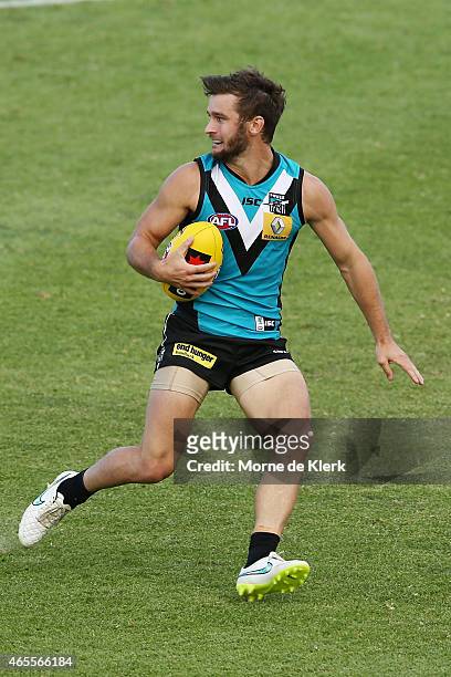 Sam Gray of the Power runs with the ball during the NAB Challenge match between the Port Adelaide Power and the West Coast Eagles at Norwood Oval on...