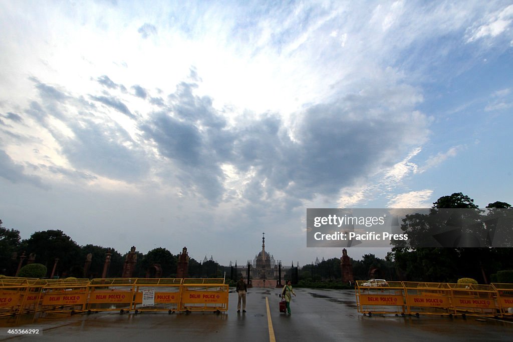 An Indian security guard stands outside the grounds of...