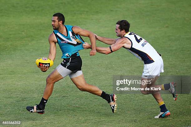 Alipate Carlile of the Power is tackled by Brant Colledge of the Eagles during the NAB Challenge match between the Port Adelaide Power and the West...