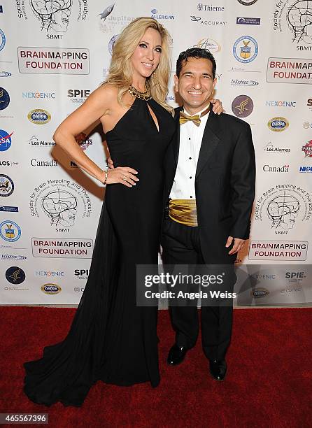 Miss United Nation International 2014 Carla Gonzalez and Babak Kateb, Chairman of the Board, CEO and Scientific Director of Society for Brain Mapping...