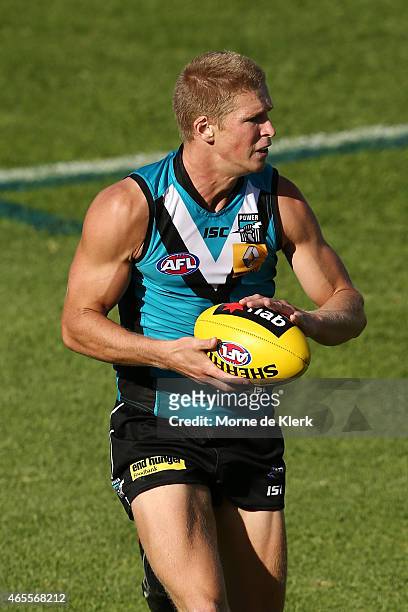 Tom Clurey of the Power runs with the ball during the NAB Challenge match between the Port Adelaide Power and the West Coast Eagles at Norwood Oval...