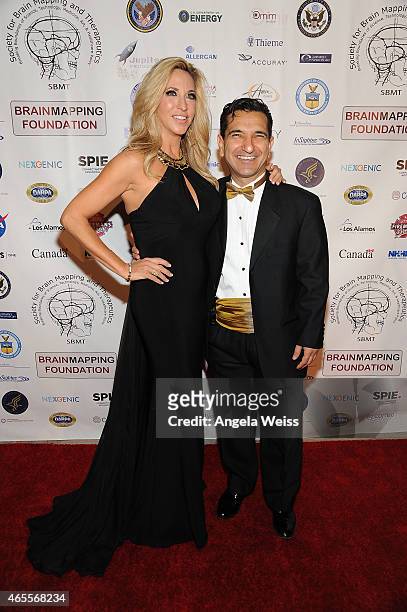 Miss United Nation International 2014 Carla Gonzalez and Babak Kateb, Chairman of the Board, CEO and Scientific Director of Society for Brain Mapping...