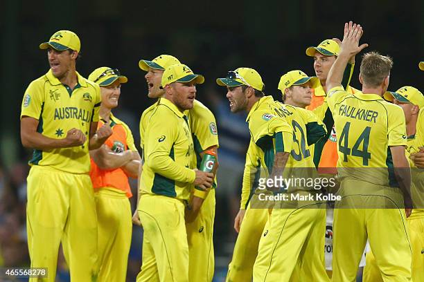 The Australian team celebrate the wicket of Tillakaratne Dilshan of Sri Lanka after he called for the DRS after being given out during the 2015 ICC...