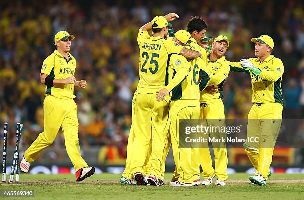 Australia celebrate as Mahela Jayawardene of Sri Lanka is run out by Michael Clarke of Australia during the 2015 ICC Cricket World Cup match between...