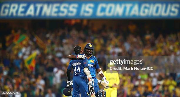 Kumar Sangakkara of Sri Lanka is congratulated by captain Angelo Mathews after he scored a century during the 2015 ICC Cricket World Cup match...