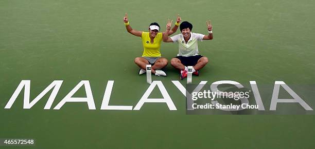 Chen Liang and Wang Yafan of China poses with the Doubles Champions Trophy after the final of the BMW Malaysian Open at the Royal Selnagor Golf Club...