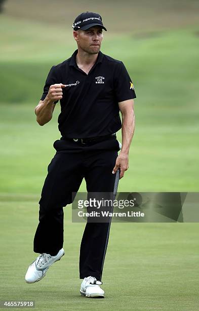 Trevor Fisher Jnr of South Africa celebrates on the 11th green during the final round of the Africa Open at East London Golf Club on March 8, 2015 in...