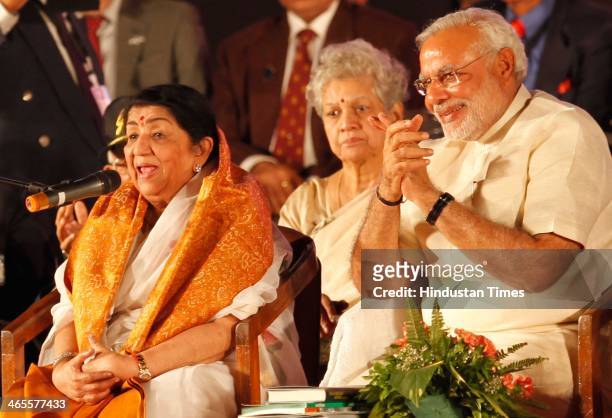 BJPs prime ministerial candidate Narendra Modi felicitates legendary singer Lata Mangeshkar during "Sherahta Bharat" Aye Mere Watan Ke Logon for...