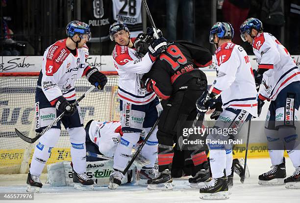 Jimmy Sharrow, Jens Baxmann,Jason Jaspers of the Thomas Sabo Ice Tigers Nuernberg, T.J. Mulock and Barry Tallackson of the Eisbaeren Berlin during...