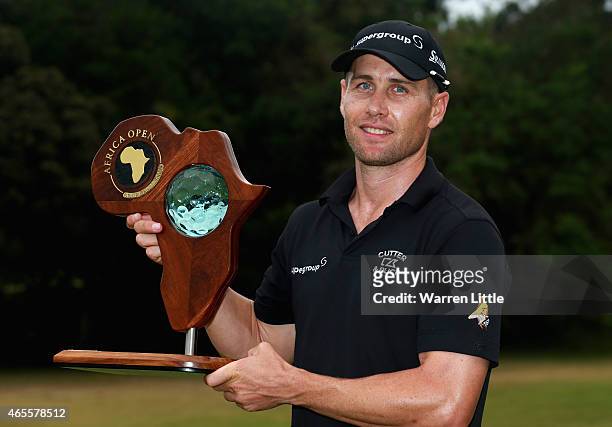 Trevor Fisher Jnr of South Africa poses with the trophy after winning the Africa Open at East London Golf Club on March 8, 2015 in East London, South...