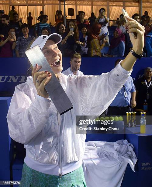 Caroline Wozniacki of Denmark takes a selfie after the Singles Final of the BMW Malaysian Open at the Royal Selnagor Golf Club Centre Court on March...